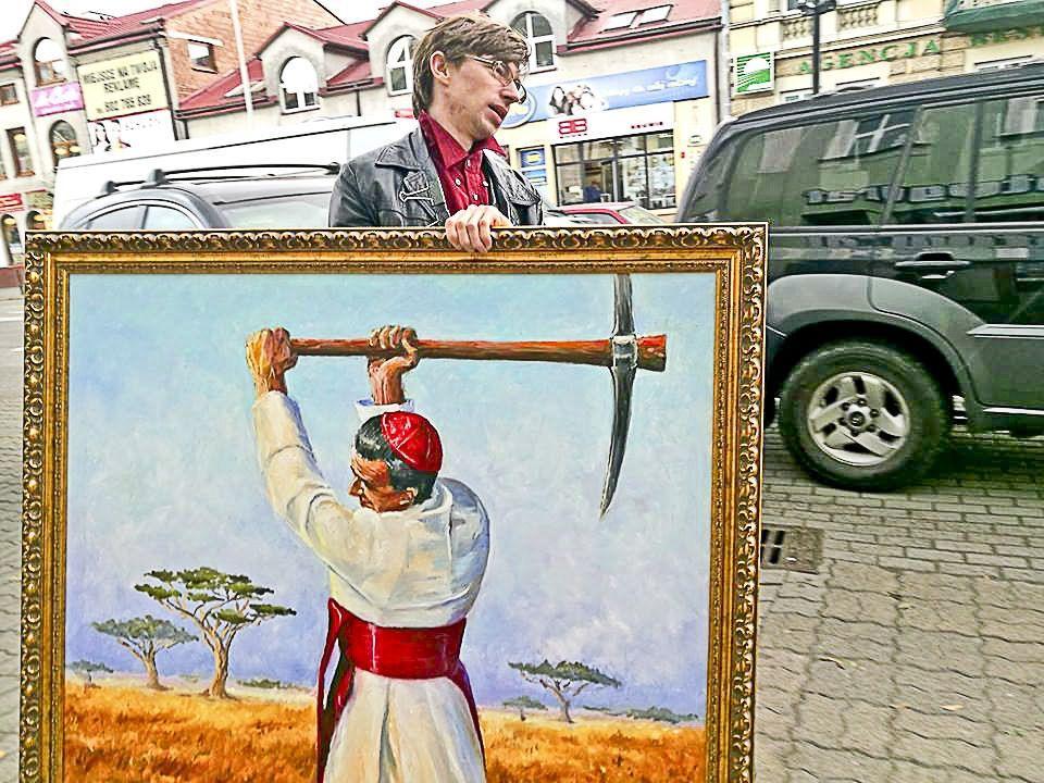 Eliasz Dyrow z obrazem przedstawiającym kard. Kozłowieckiego.